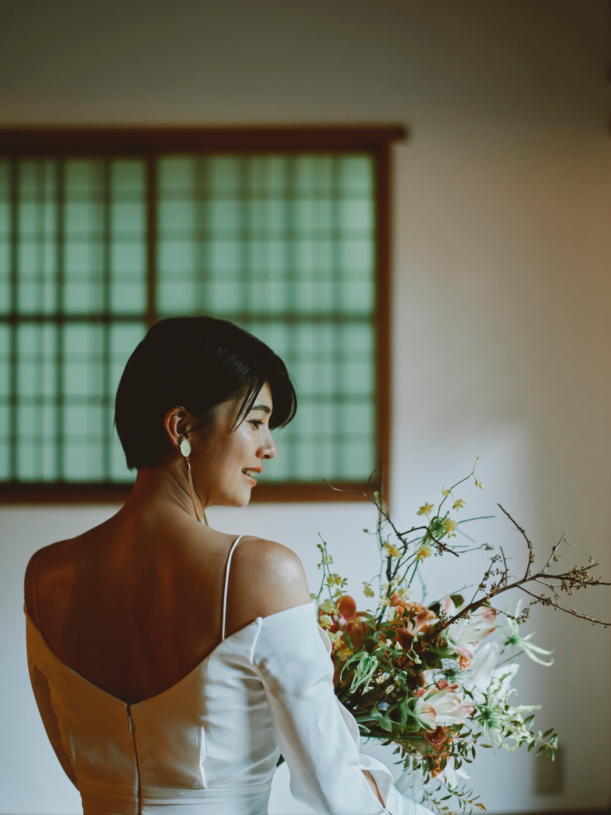 Over the shoulder bouquet and dress